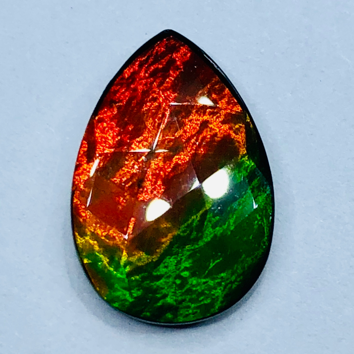 Canadian Ammolite 15x10mm Faceted Triplet – Red & Green Gem