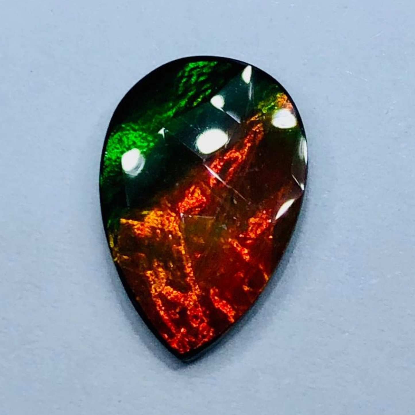 Canadian Ammolite 15x10mm Faceted Triplet – Red & Green Gem