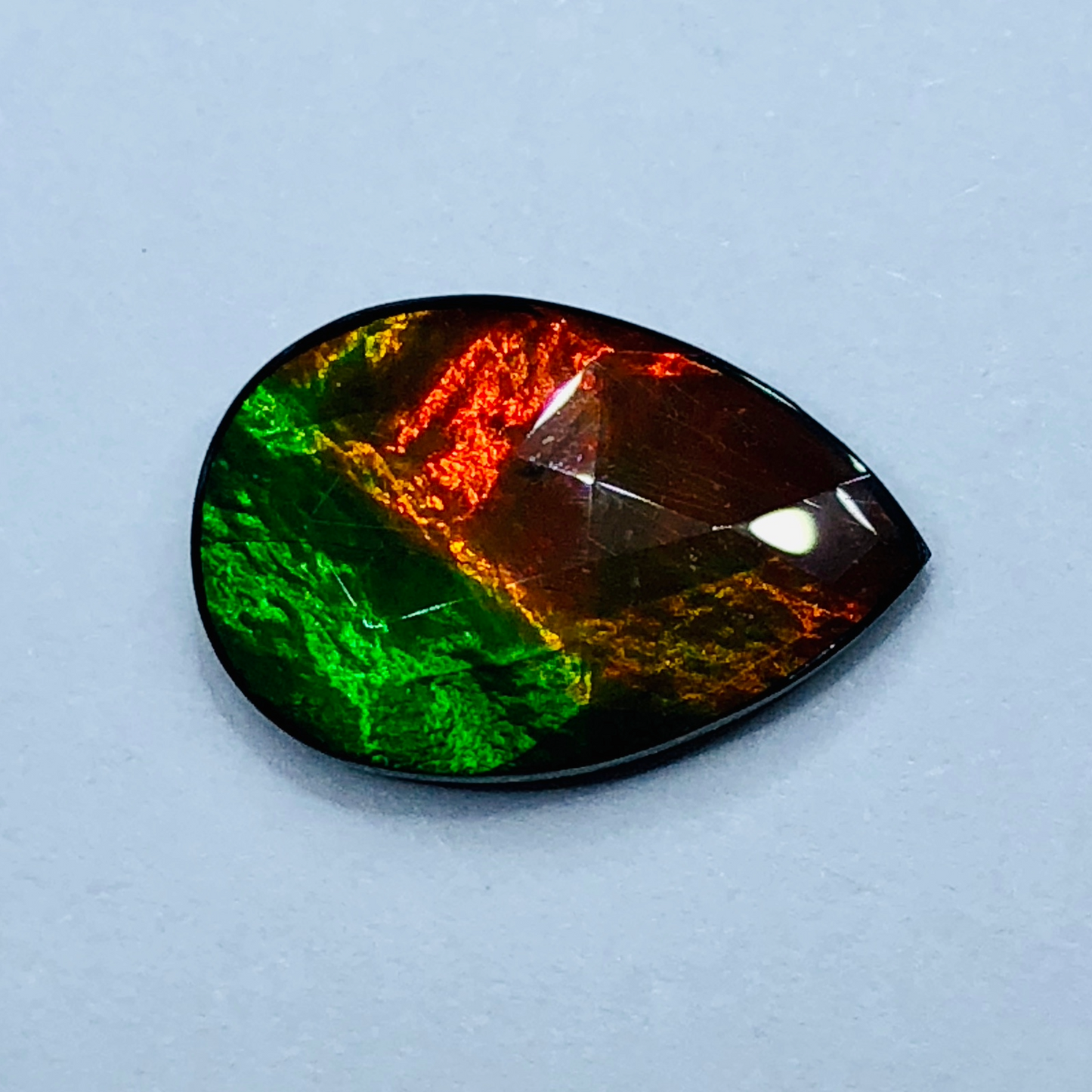 Canadian Ammolite 15x10mm Faceted Triplet – Red & Green Gem