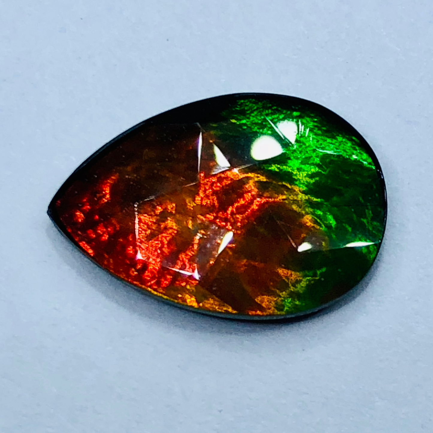 Canadian Ammolite 15x10mm Faceted Triplet – Red & Green Gem
