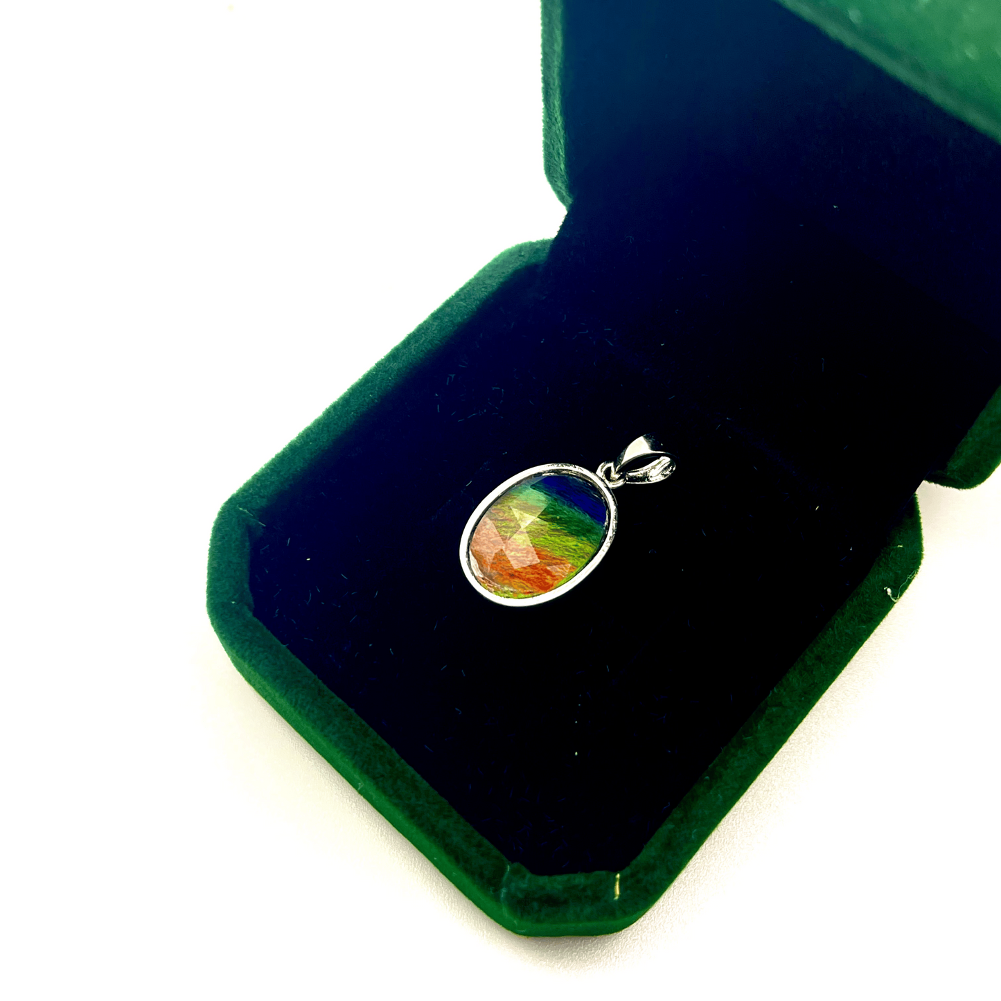 Faceted Oval Ammolite Sterling Silver Pendant featuring a Five Color 10x14 Triplet Gems