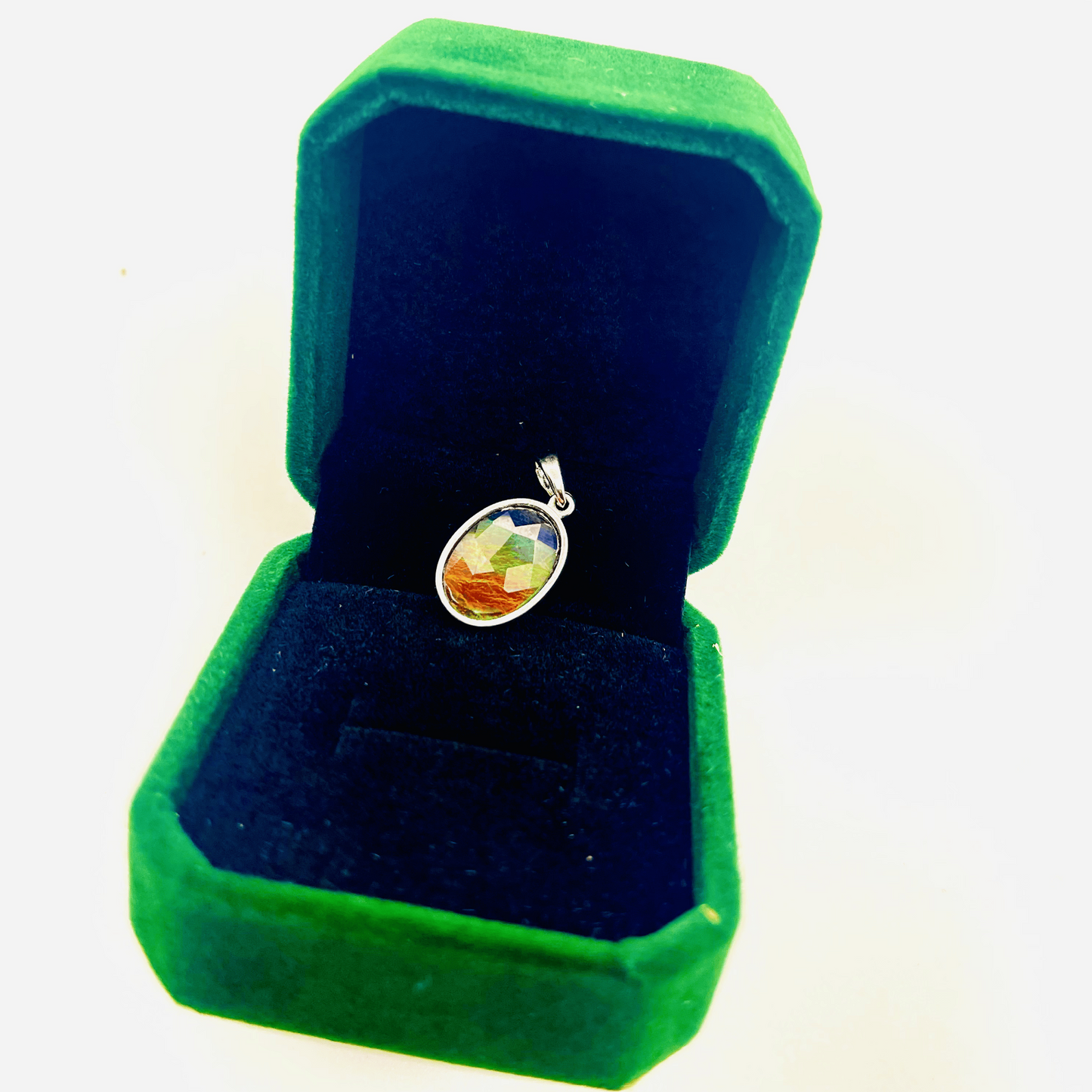 Faceted Oval Ammolite Sterling Silver Pendant featuring a Five Color 10x14 Triplet Gems