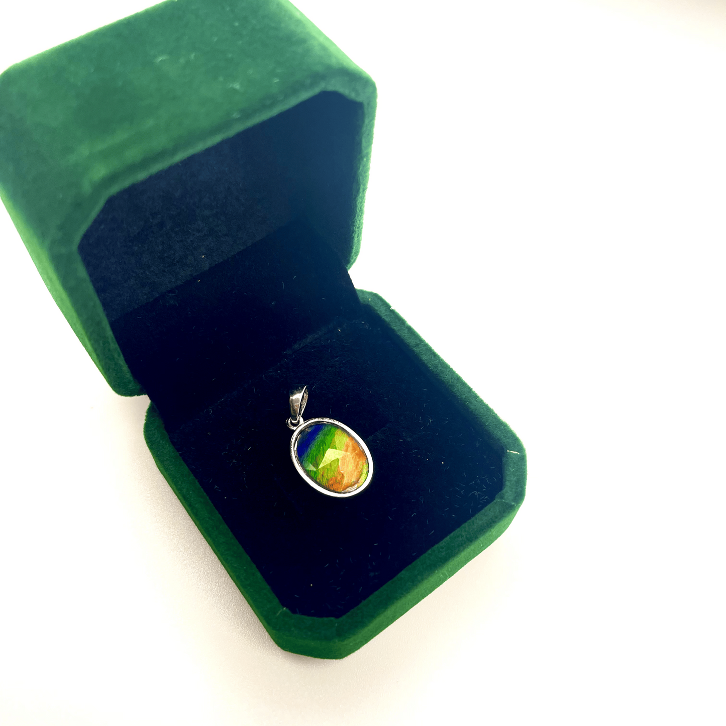 Faceted Oval Ammolite Sterling Silver Pendant featuring a Five Color 10x14 Triplet Gems