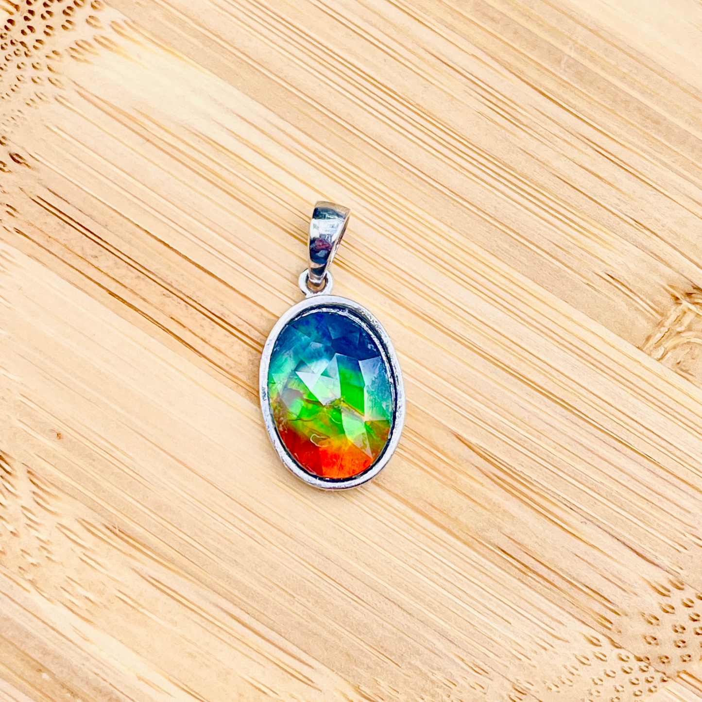 Faceted Oval AA Grade Ammolite Sterling Silver Pendant – Deep Blue, Green & Red 10x14mm Triplet Gem