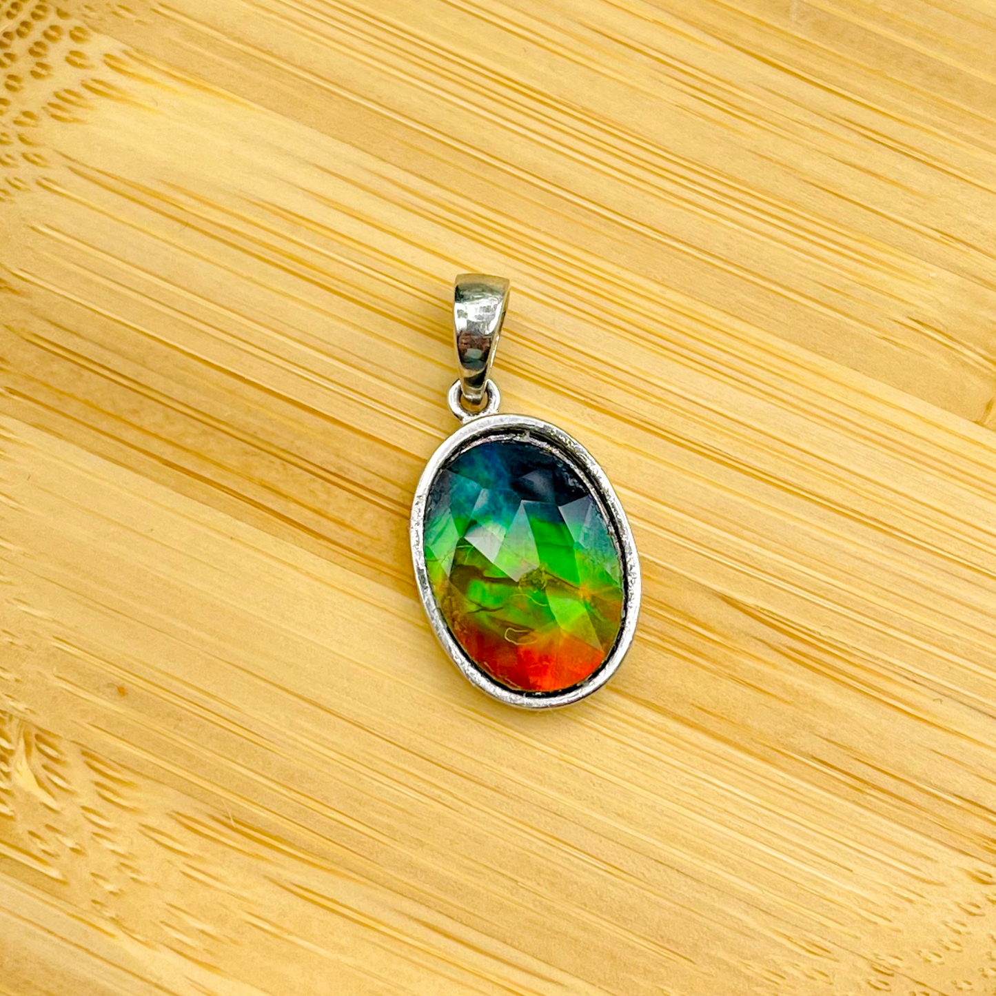 Faceted Oval AA Grade Ammolite Sterling Silver Pendant – Deep Blue, Green & Red 10x14mm Triplet Gem