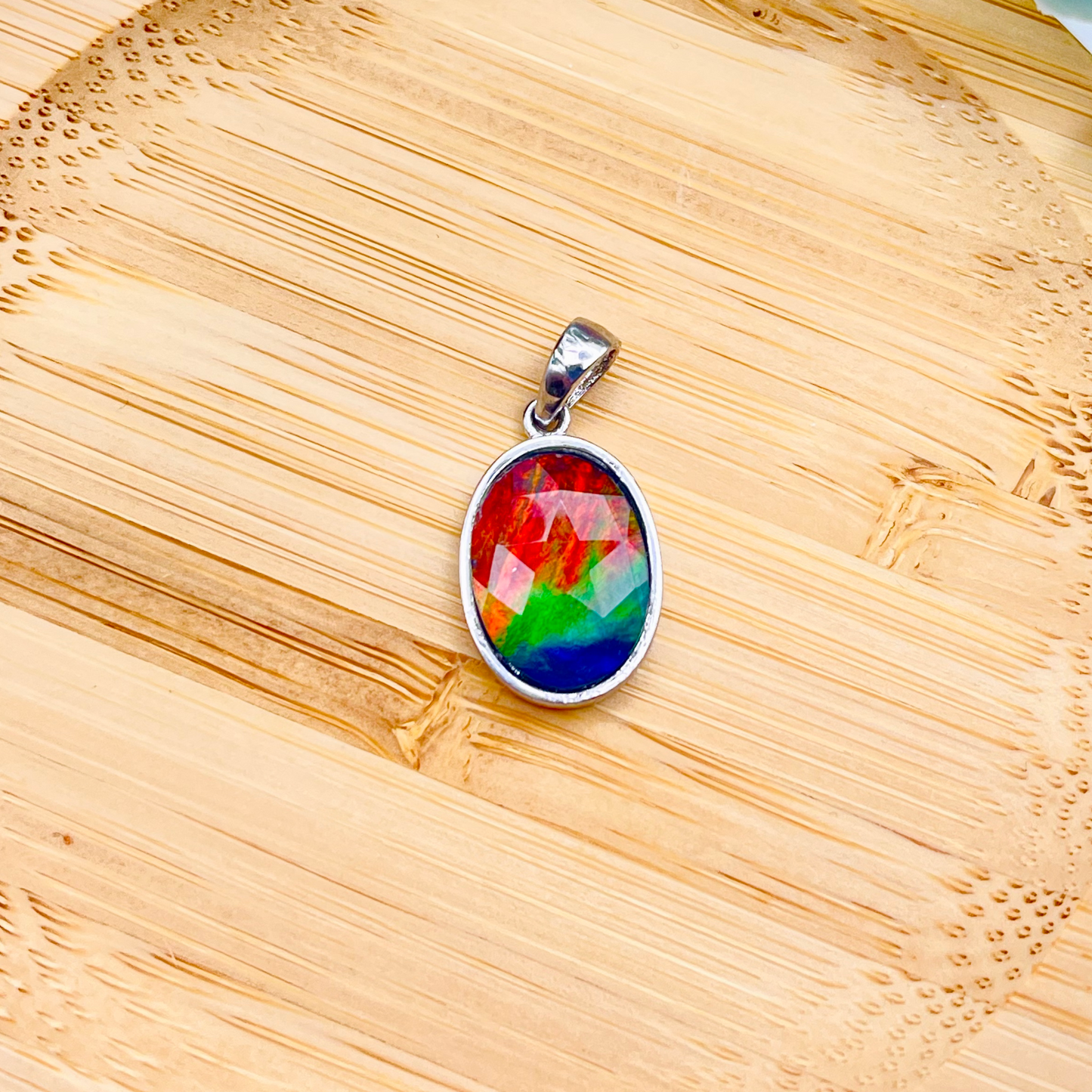 Faceted Oval AA Grade Ammolite Sterling Silver Pendant – Red, Green & Blue 10x14mm Triplet Gem