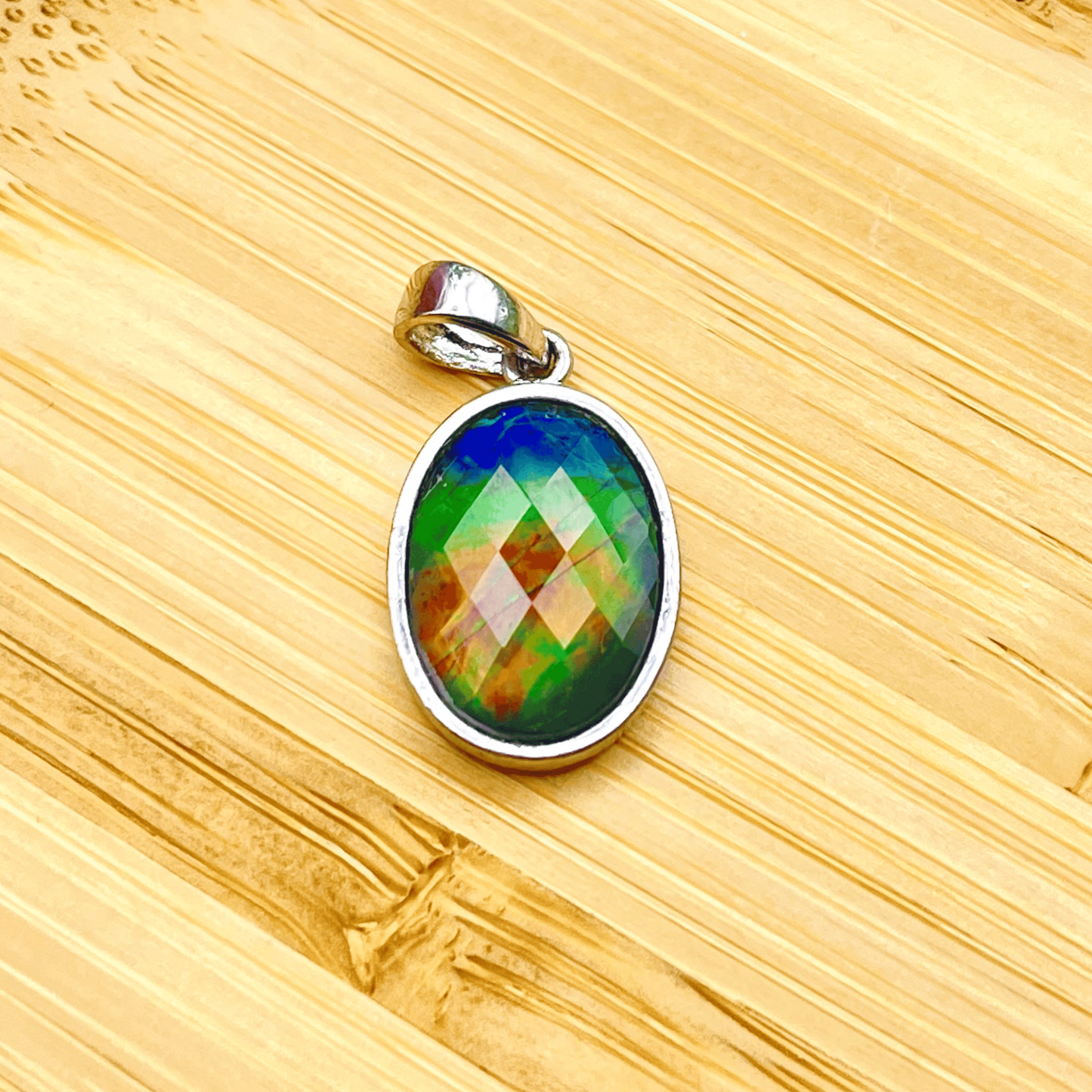 Faceted Oval AA Grade Ammolite Sterling Silver Pendant – Blue, Green & Hints of Red-Orange 10x14mm Triplet Gem