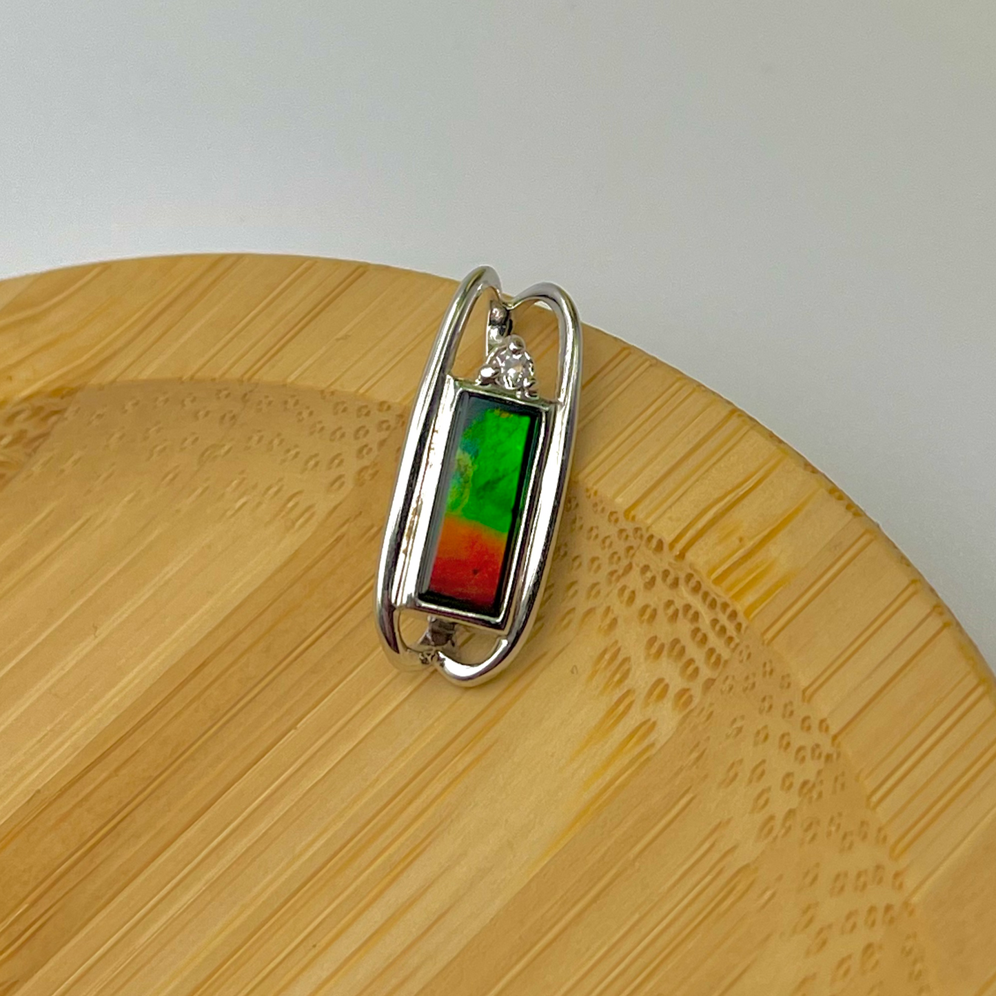 Genuine Canadian Ammolite 4x10 rectangular Sterling Silver Pendant with white Sapphire